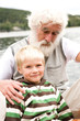 Grandfather sitting with grandson, portrait