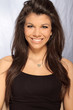 woman posing and smiling at camera