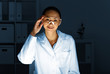 Photo: Young chemist working in laboratory Young chemist working in laboratory