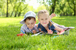 Children in the park reading a book Children in the park reading a book