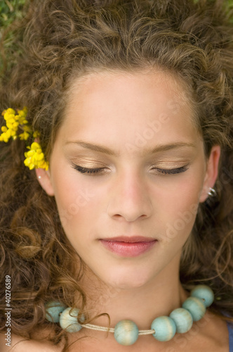 Photo: Young woman lying, eyes closed Young woman lying, eyes closed