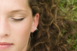 Young woman lying, eyes closed