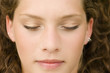 Young woman lying, eyes closed