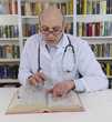 Doctor looking up information on medicine Doctor looking up information on medicine