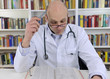 Doctor looking up information on medicine Doctor looking up information on medicine
