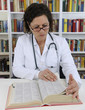 Doctor looking up information on medicine Doctor looking up information on medicine