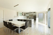 Photo: beautiful modern house, view of kitchen with dining table beautiful modern house, view of kitchen with dining table