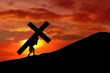 Christian background - man carrying a cross up hill