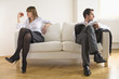 Mid adult couple sitting on sofa