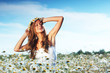 girl in dress on the daisy flowers field