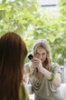 Young woman photographing with mobile phone