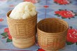 Foto: Asian sticky rice in a bamboo wooden old style box Asian sticky rice in a bamboo wooden old style box