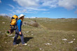 Backpacker girl traveling in a steppe