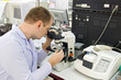 Man working with a microscope in Laboratory