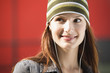 Young woman wearing headphones, smiling