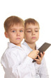 Photo: Two reading boys with electronic book Two reading boys with electronic book