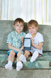 Two reading boys. With electronic book