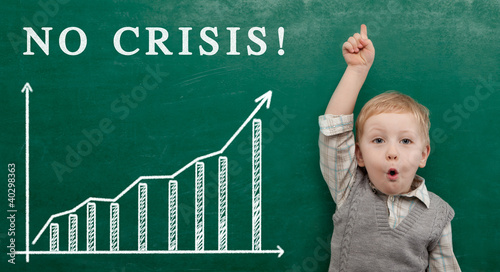 Photo: Cheerful smiling child at the blackboard. Cheerful smiling child at the blackboard.