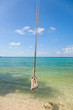 tropical beach with Old  Swing Tied to tree