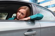 Pretty woman in the car looking outside