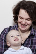 Joyful cute baby girl with mother Joyful cute baby girl with mother