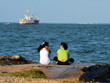 Women relaxing and conversation on the beach