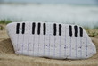 piano keyboard painted on a stone