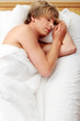 Man sleeping in his bed.