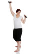 Young woman during fitness time and exercising with dumbbells Young woman during fitness time and exercising with dumbbells