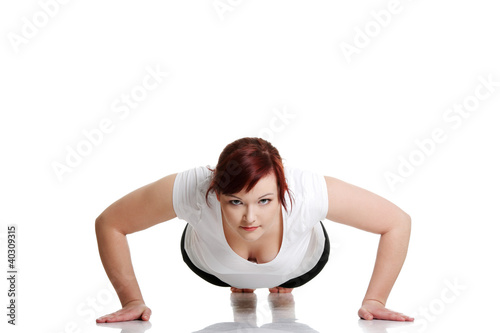 Foto: Young woman during fitness time and exercising Young woman during fitness time and exercising