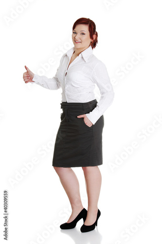 Photo: Young businesswoman gesturing ok. Young businesswoman gesturing ok.