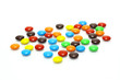 lots of colorful candies spread on white background