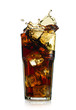 Splashing cola in glass. Isolated on white background