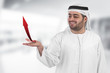 arabian businessman with an arrow chart diagram presentation