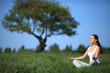 beautiful young girl training yoga on sunny meadow beautiful young girl training yoga on sunny meadow