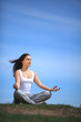 beautiful young girl training yoga on sunny meadow beautiful young girl training yoga on sunny meadow