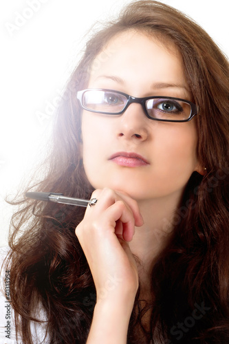 Photo: Beautiful brunette model in reading glasses Beautiful brunette model in reading glasses