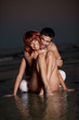 young couple having fun on the beach