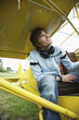 Young man sitting in airplane