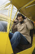 Young man sitting in airplane