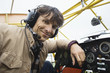 Young man sitting in airplane