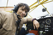 Young man sitting in airplane