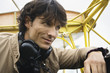 Young man sitting in airplane