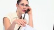 Businesswoman with glasses phoning