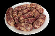 Raw fried sausage isolated on black with clipping path