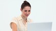 Smiling young worker on a laptop