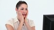 Young woman holding her face in her hands