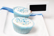 Twobaby blue cupcakes on a plate with label Twobaby blue cupcakes on a plate with label
