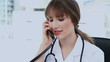 Young doctor picking up the phone