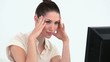 Young worker with hands on forehead